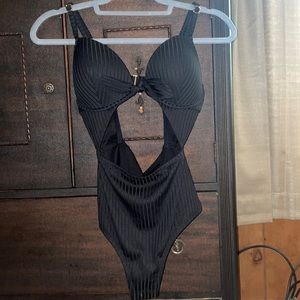 One peice shade shore bathing suit with a middle cutout